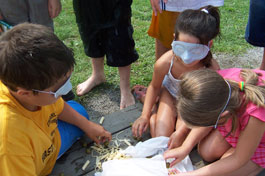 Children participate in a blindfolded object guessing contest